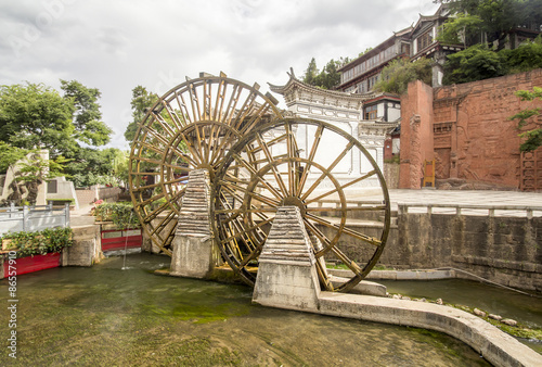 Water wheels in old town of Lijiang , Yunnan China.