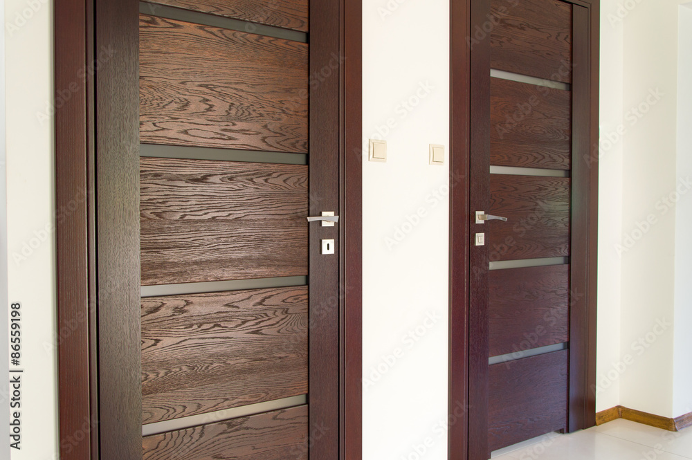 Obraz premium Two pair of brown wooden doors