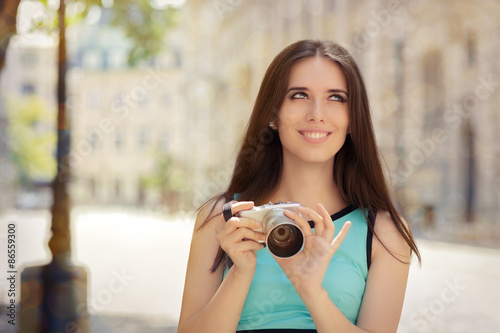 Happy Elegant Woman with Compact Digital Camera