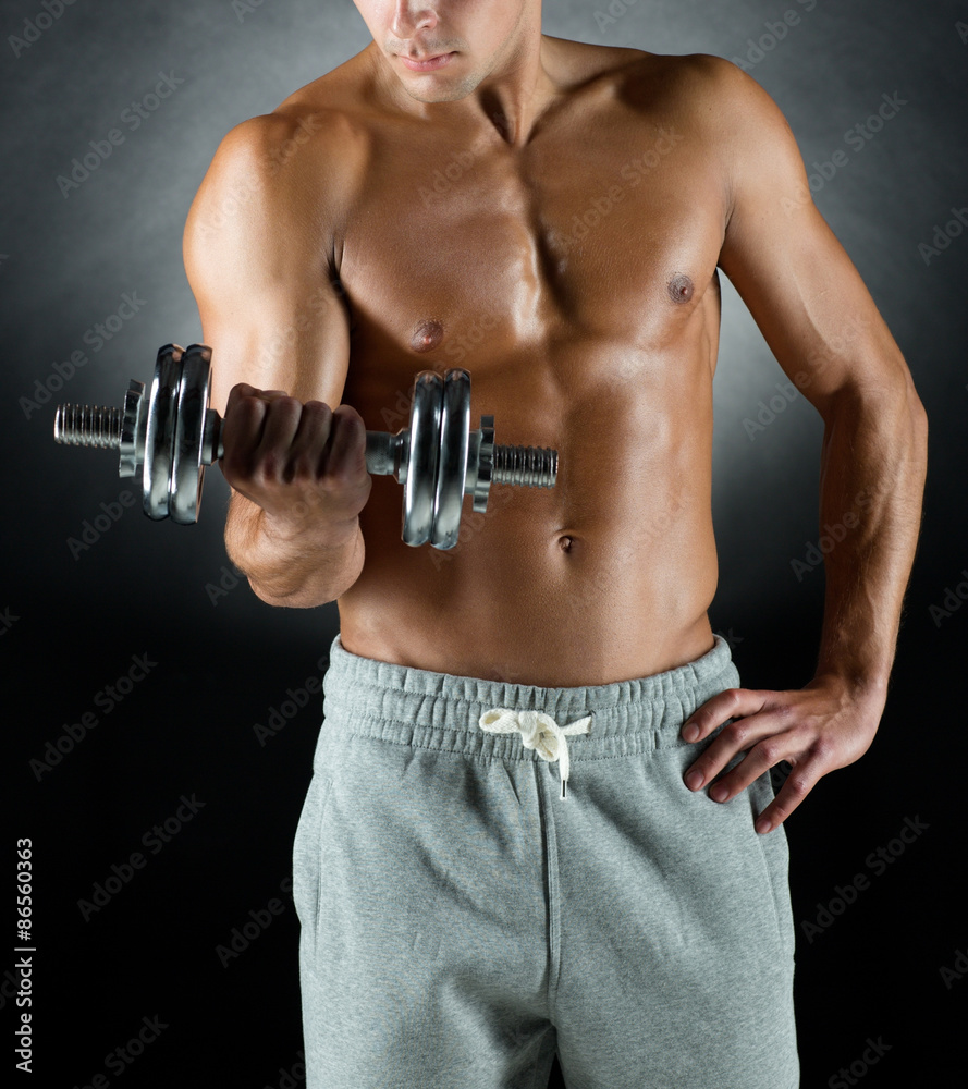 young man with dumbbell young man with dumbbell