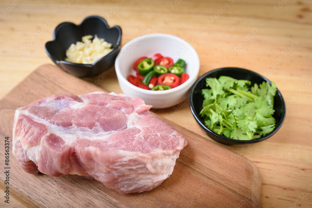 Raw pork on board and vegetables Raw pork on board and vegetables