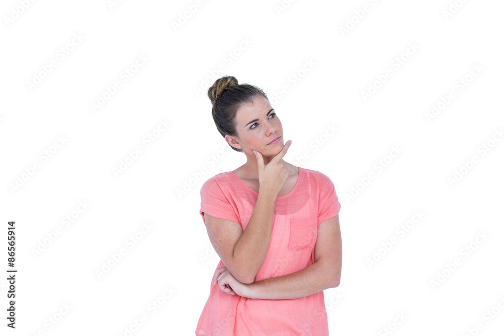 Thoughtful pretty casual brunette standing with hand on chin Thoughtful pretty casual brunette standing with hand on chin