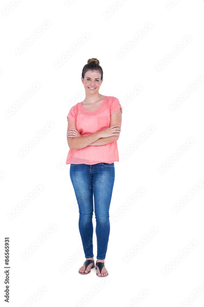Happy pretty casual brunette looking at camera with arms crossed Happy pretty casual brunette looking at camera with arms crossed