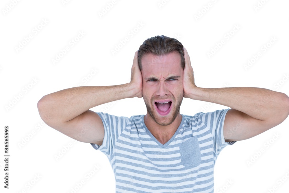 Handsome casual man screaming with hand on ears Handsome casual man screaming with hand on ears