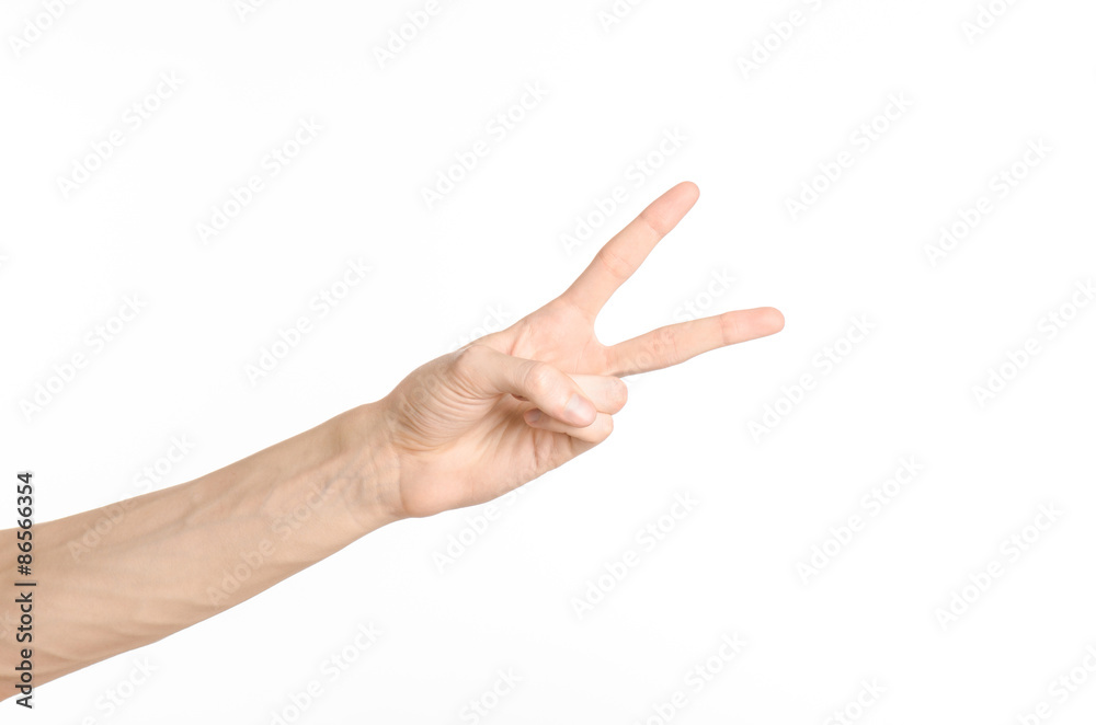 Hand gestures theme: the human hand shows gestures isolated on white background in studio Hand gestures theme: the human hand shows gestures isolated on white background in studio