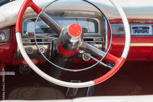 The dashboard of old red car