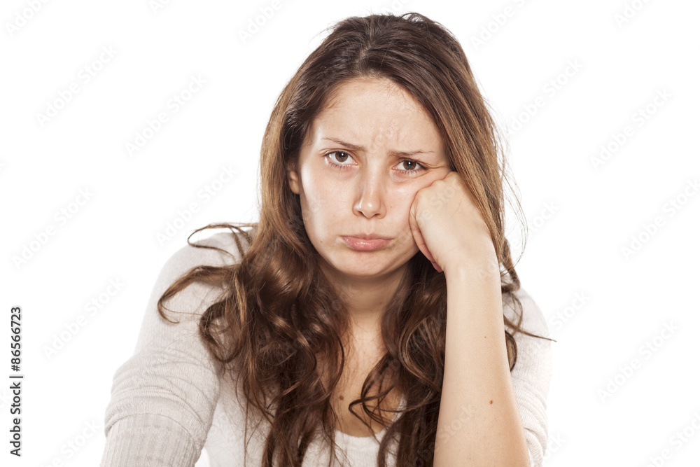 Fototapeta premium sulk young woman on a white background