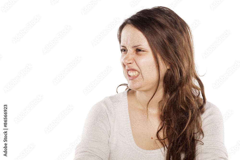 squeamish young woman on a white background