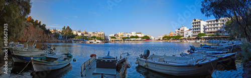 Panorama of Voulismeni lake with boats in Agios Nikolaos, Crete island, Greece.