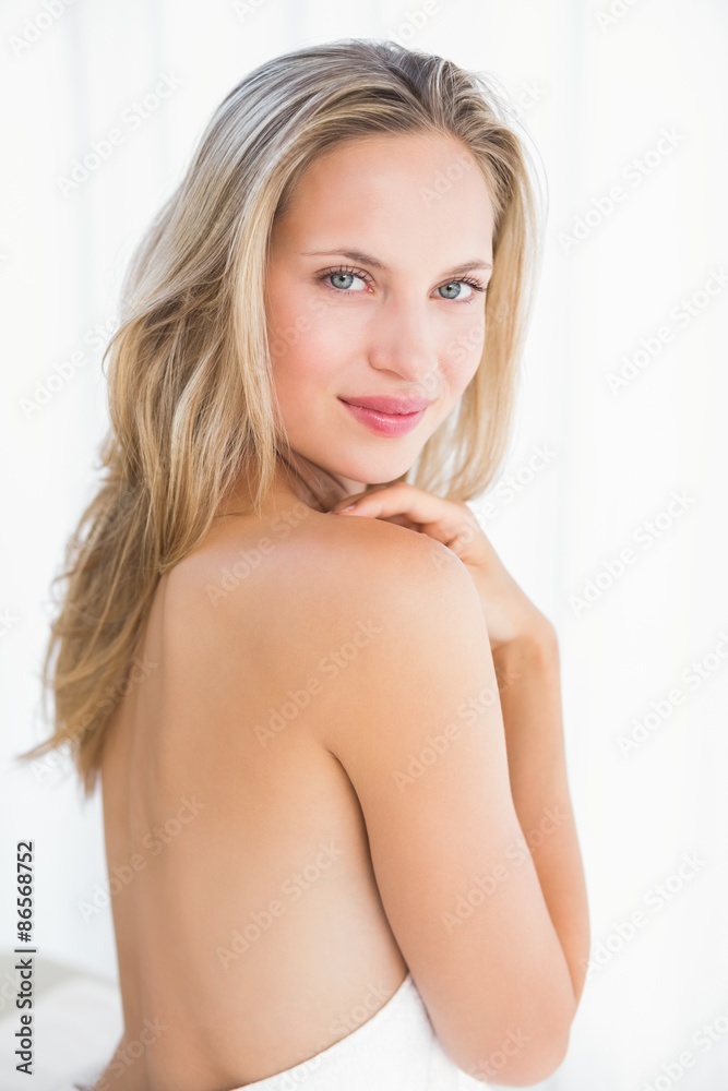 Obraz premium Pretty blonde sitting on massage table