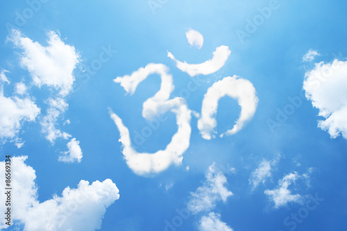 Om symbol clouds shaped on sky.