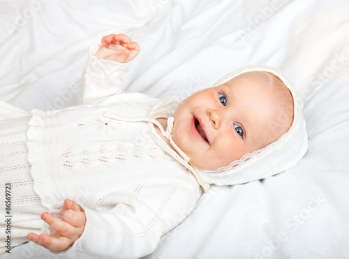 Tablou Canvas Infant in baptismal clothes
