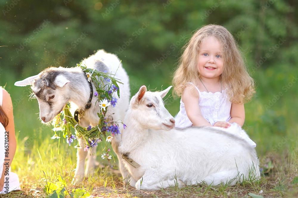 Fototapeta premium portrait of a beautiful little girl in summer