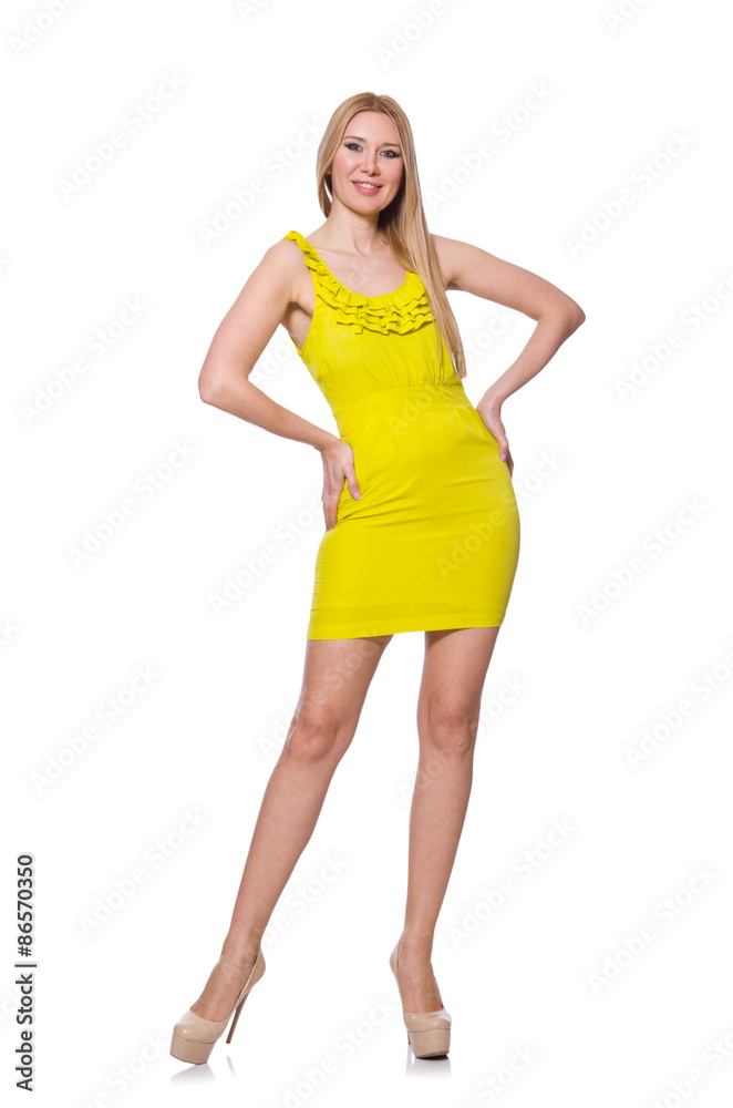 Fototapeta premium Pretty tall woman in short yellow dress isolated on white