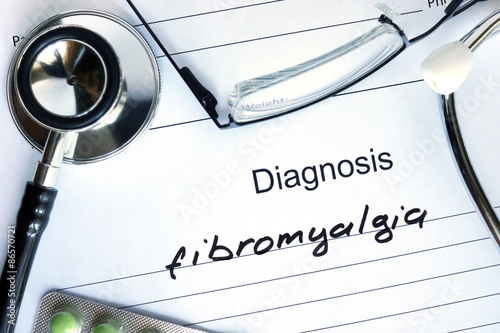 Diagnostic form with diagnosis Fibromyalgia and pills. photo