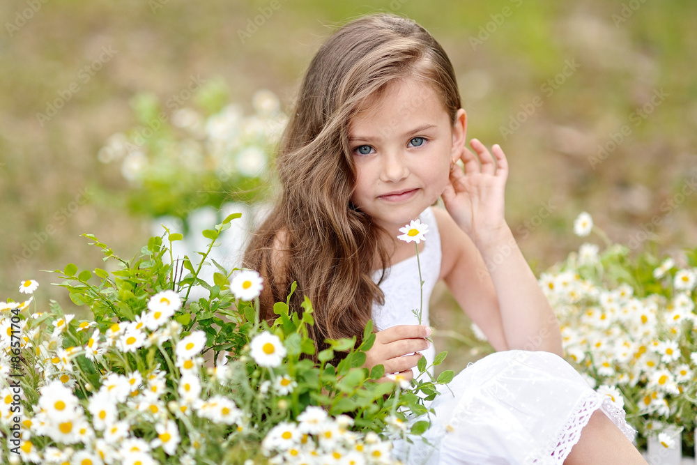 portrait of a beautiful little girl with flowers portrait of a beautiful little girl with flowers