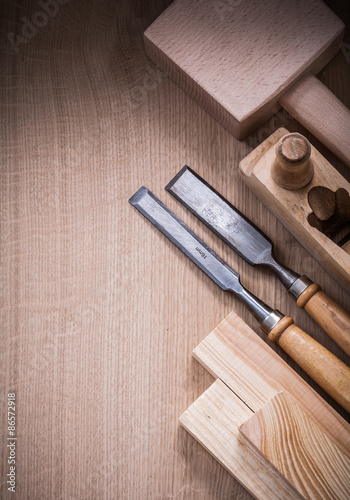 Collection of wooden carpenterâs tools on wood board construct