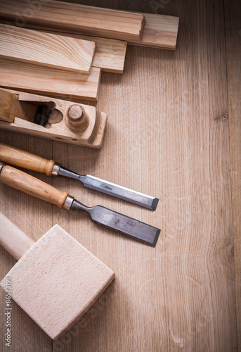 Group of wooden joinerâs working tools on wood board close up 