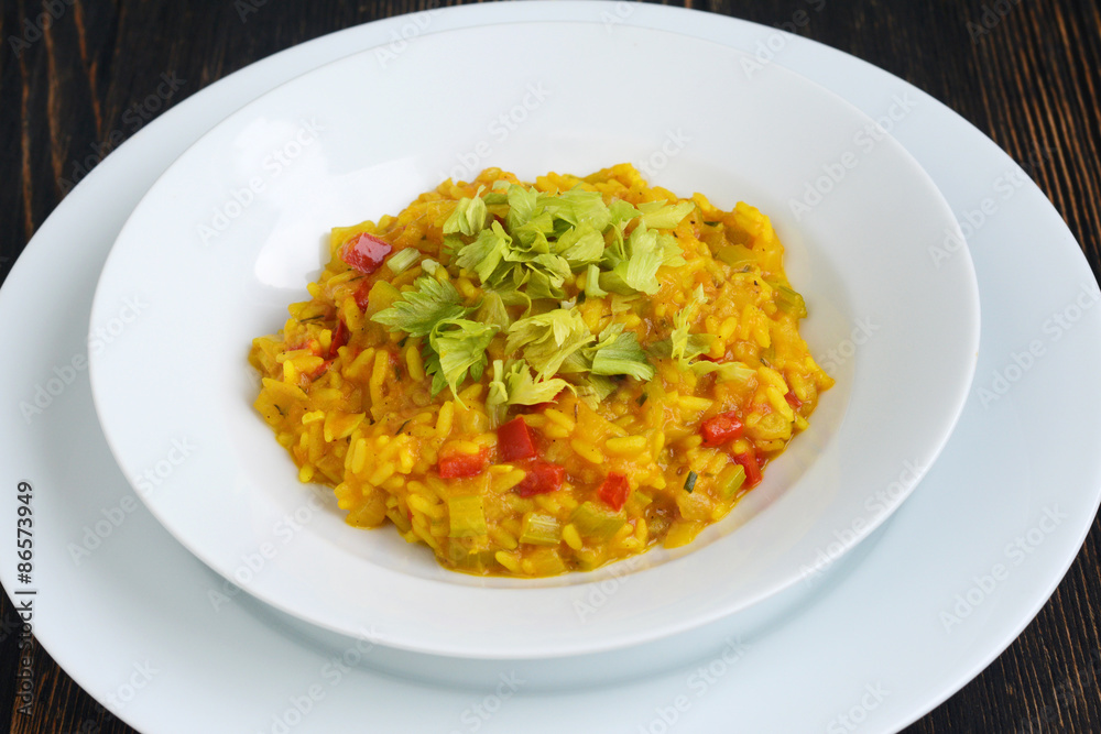 Pumpkin risotto on the wooden table Pumpkin risotto on the wooden table