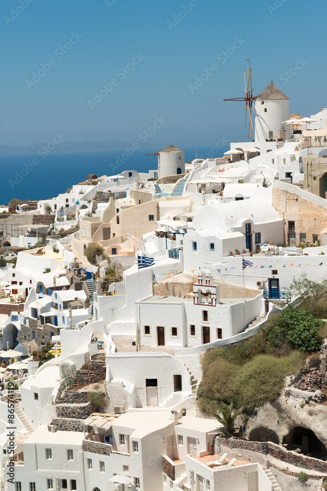 Panorama of traditional terraced houses in Oia, Santorini