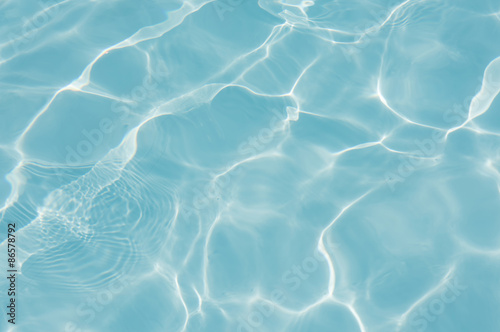 Fototapeta Naklejka Na Ścianę i Meble -  Blue water surface in swimming pool