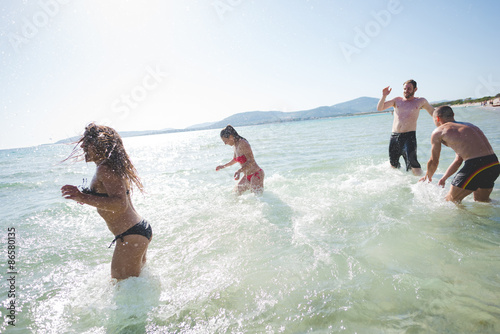 group of young multiethnic friends beach summer