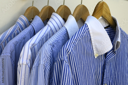 Shirts on wooden hangers