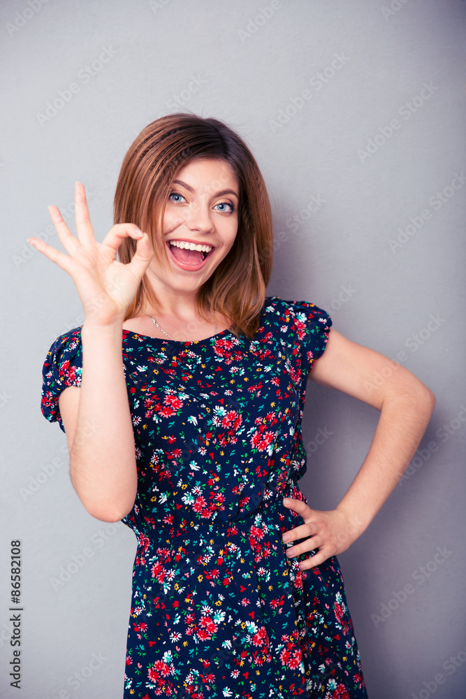 Smiling young girl showing ok sign Smiling young girl showing ok sign