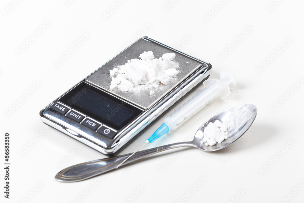 Syringe and digital scales with drugs
