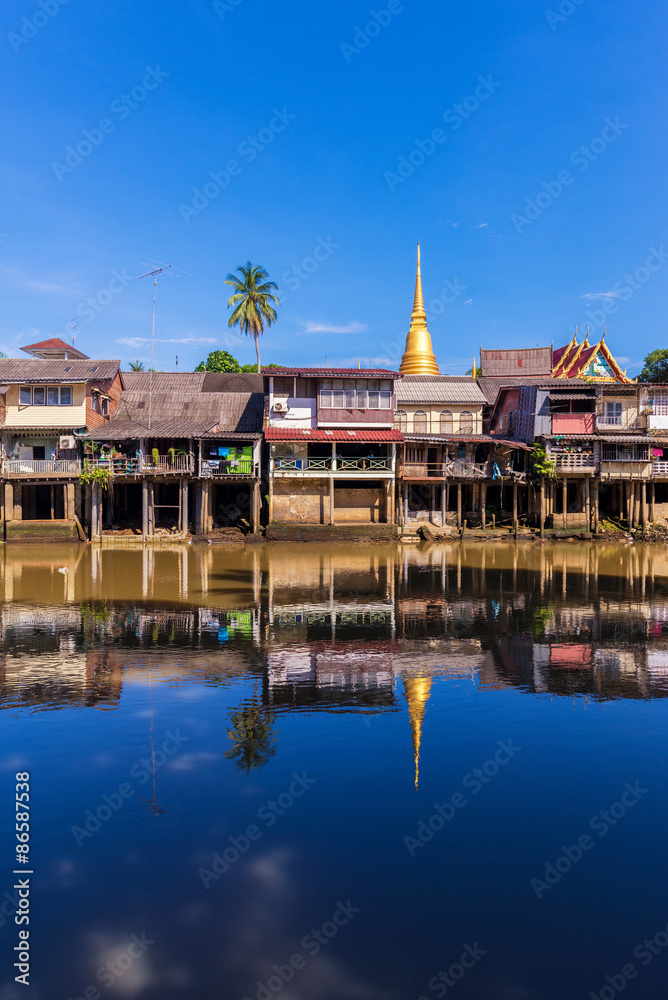village near river in morning with clear blue sky village near river in morning with clear blue sky