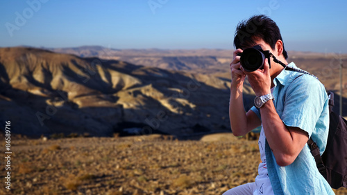 Photography Japanese young photographer taking photos in the mountain / 山頂でカメラを構えるカメラマン