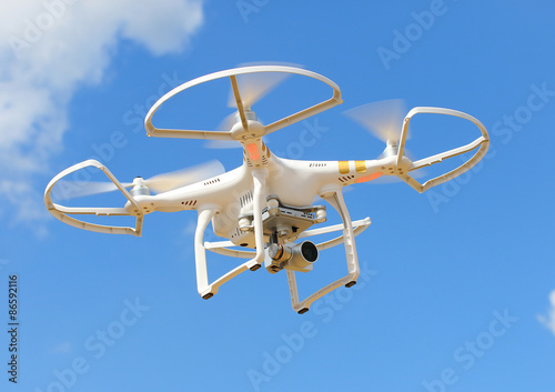 Drone quadrocopter with high resolution digital camera. New tool for aerial photo and video. 