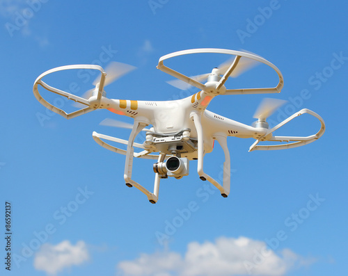 Drone quadrocopter with high resolution digital camera. New tool for aerial photo and video. 