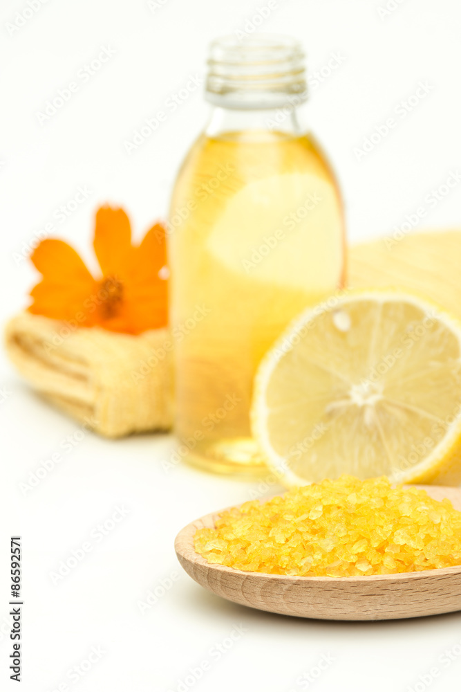 Spa and wellness setting with sea salt, oil essence, flowers Spa and wellness setting with sea salt, oil essence, flowers