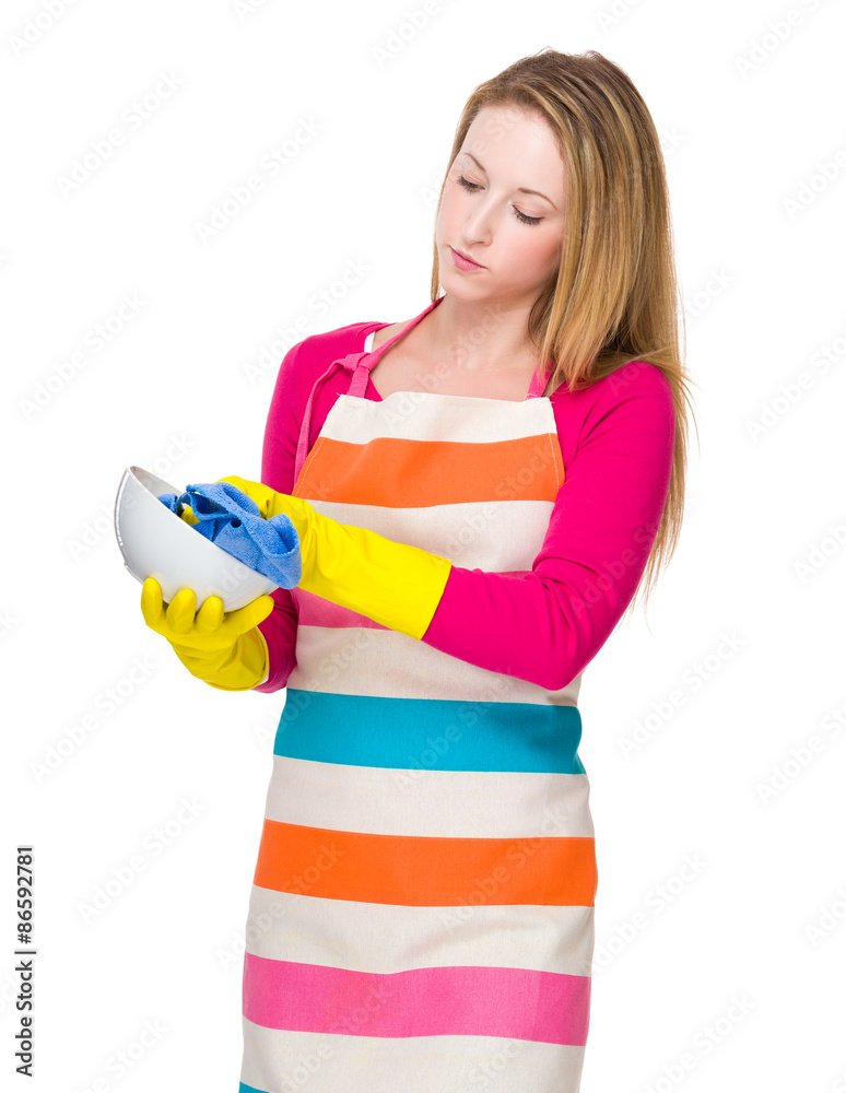 Young housewife washing the bowl Young housewife washing the bowl