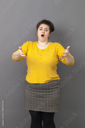 complaining overweight 20's woman expressing exasperation and frustration in front of someone © STUDIO GRAND WEB