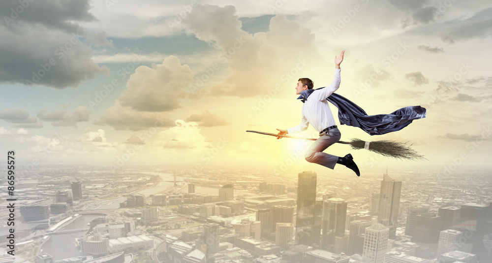 Businessman on broom