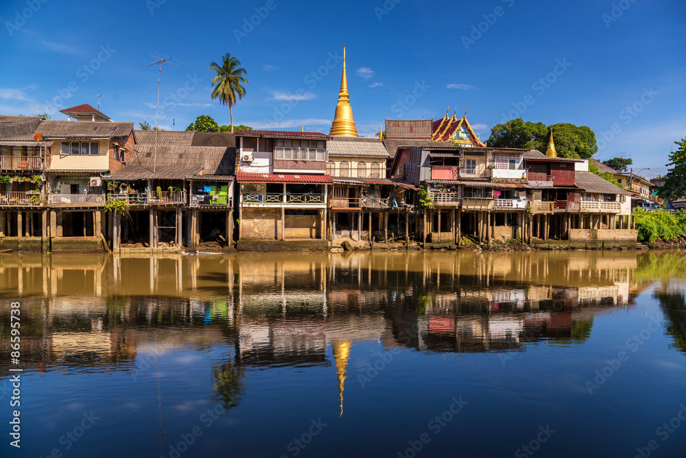 village near river in morning with clear blue sky village near river in morning with clear blue sky
