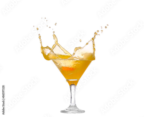 splash of orange juice in a glass isolated on white