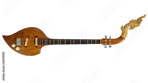 Thai musical instruments, Electric wooden pin with the great Naga head Isolated on white background. Clipping path.