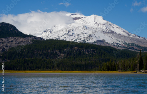 Snow-covered mountain and blue lake © Rex Wholster