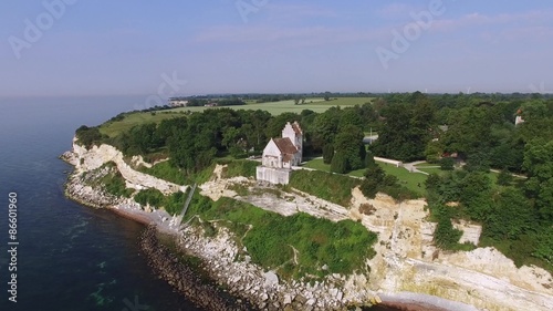 Aerial view of Stevns cliff and Hoejerup Old Church located in Zealand, Denmark photo