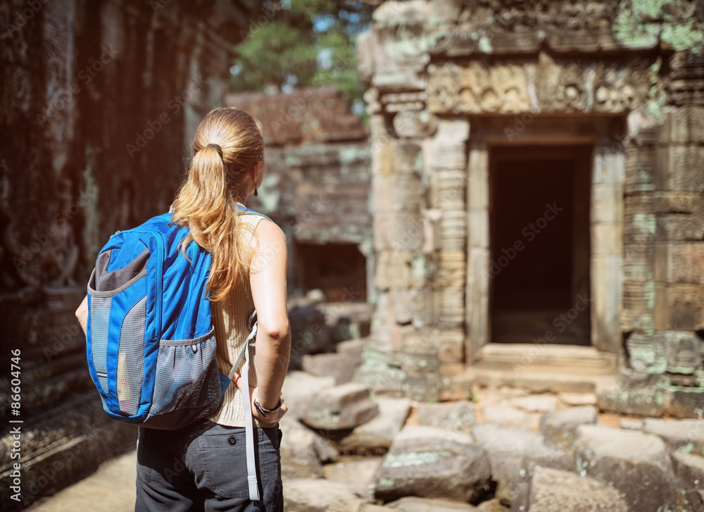 Tourist looking at the Preah Khan temple in Angkor, Cambodia