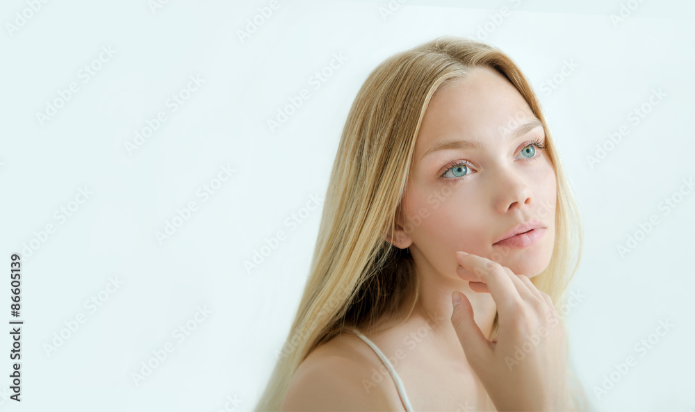 Fototapeta premium Beautiful young woman with clean fresh skin