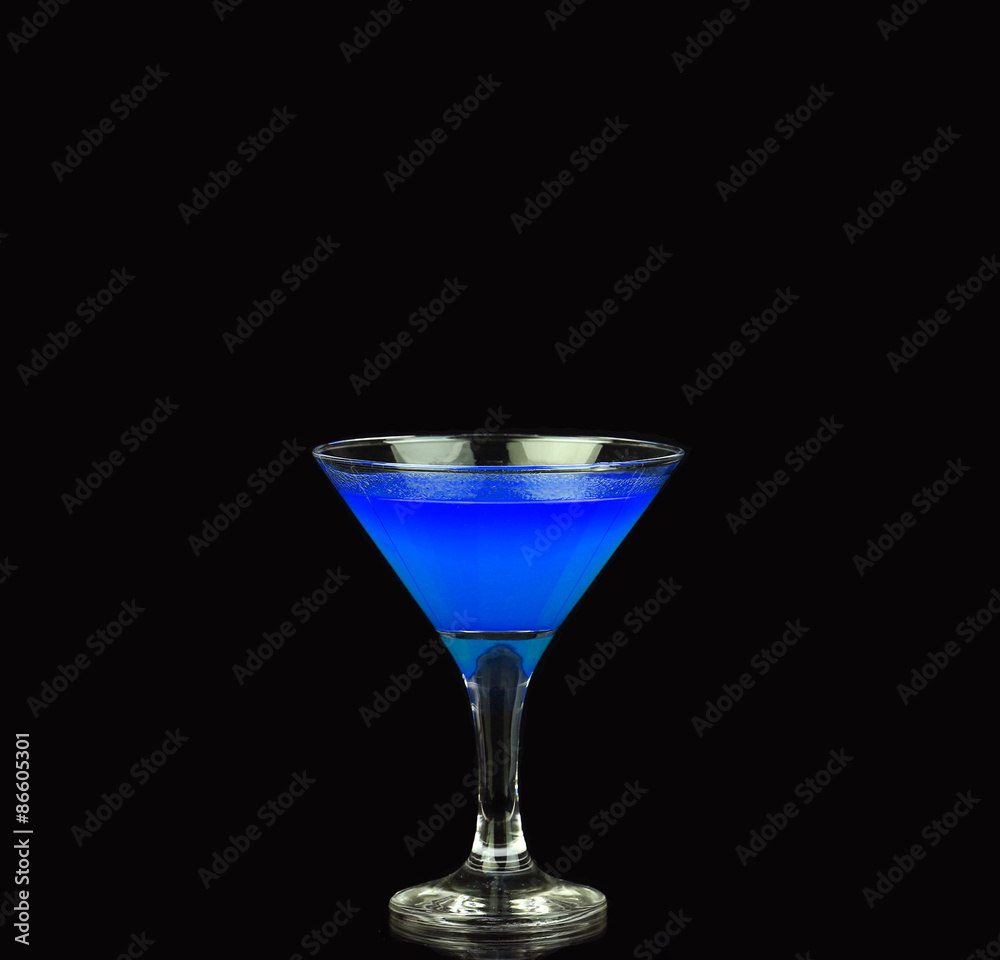 Blue alcoholic cocktail on the black background