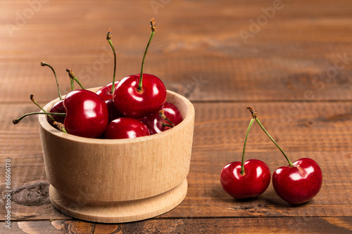 Cherries on wooden table