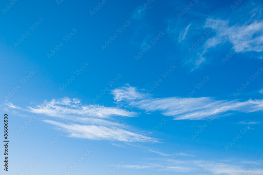 White fluffy clouds in the blue sky White fluffy clouds in the blue sky