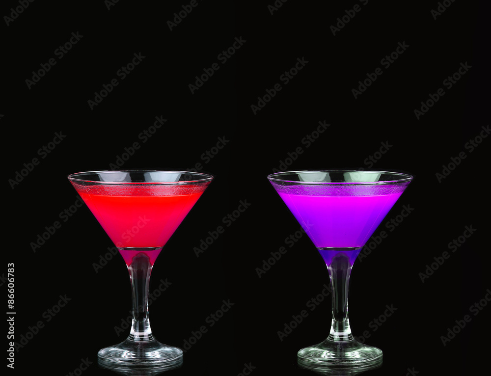 Cosmopolitan cocktail in nice red, purple in front of a black background Cosmopolitan cocktail in nice red, purple in front of a black background