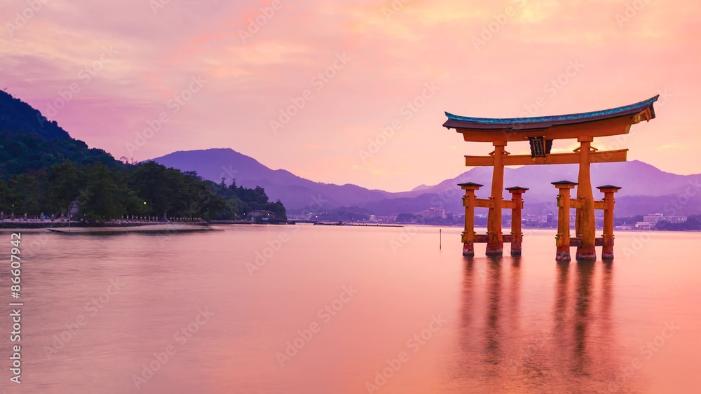 Sunset time-lapse of the famous orange shinto gate (Torii) of Miyajima island of Hiroshima prefecture, Japan. Sunset time-lapse of the famous orange shinto gate (Torii) of Miyajima island of Hiroshima prefecture, Japan.