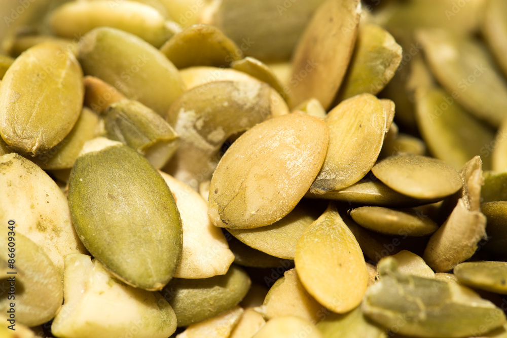 Fototapeta premium pumpkin seeds as a background. close